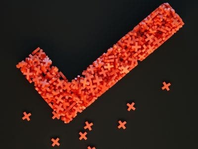 A giant red checkmark made of many smaller red X's.